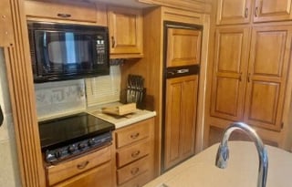 A 5th wheel travel trailer suited for 2 people