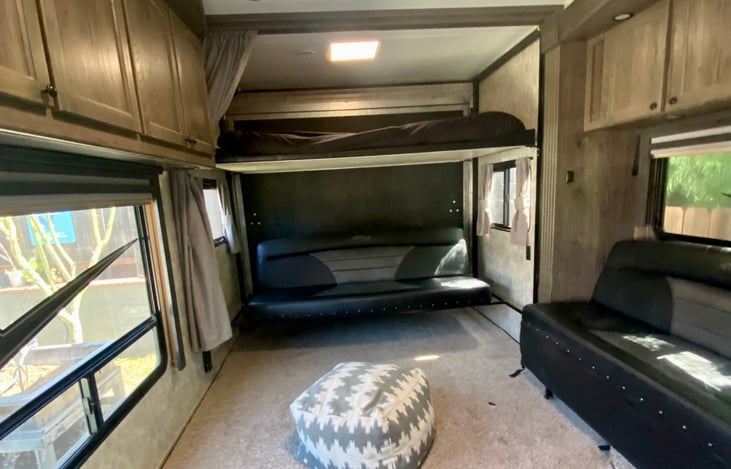 Electric Bed w/ Single Lounge and Ladder. Bottom bunk can lay flat or turn into a couch