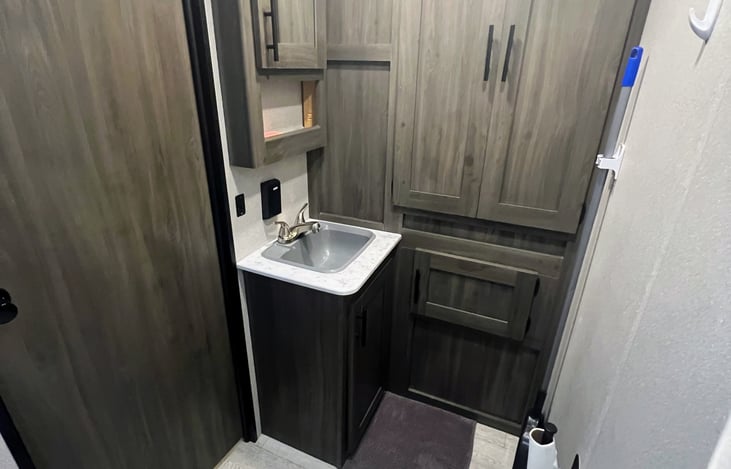 Bathroom sink, medicine cabinet, linen closet