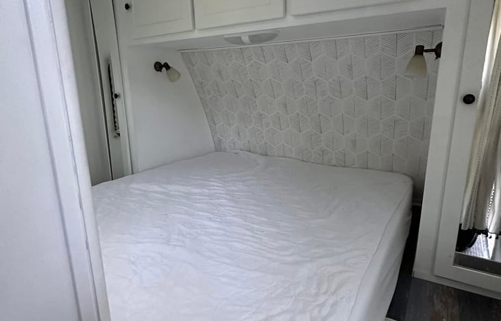 Updated pictures of bedroom after adding wallpaper to the headboard area 5/2024