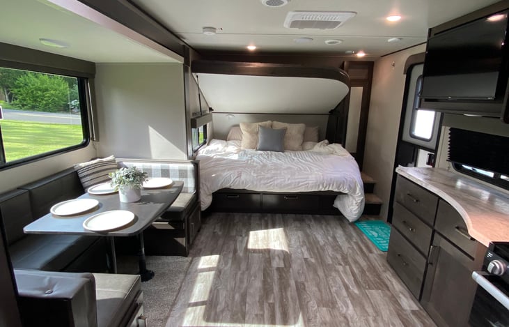 We’ve added a KING size memory foam
mattress top to the bottom bunk that EASILY folds up and into a couch. Linen provided.