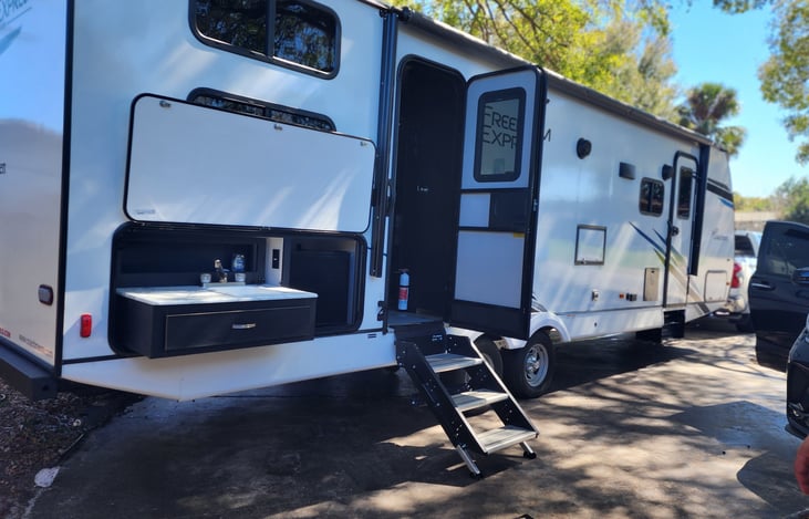 Outdoor space !!! With awning that open up for extra cover and outdoor Bluetooth speakers and l.e.d light