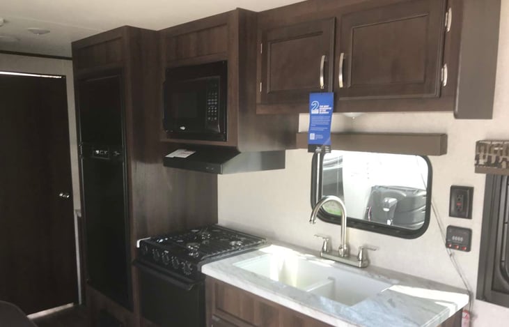 Kitchen (dinette - booth seating for four is directly across from sink)