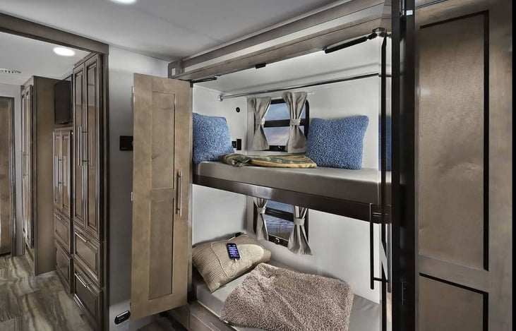 Bunk room with closing doors for privacy.