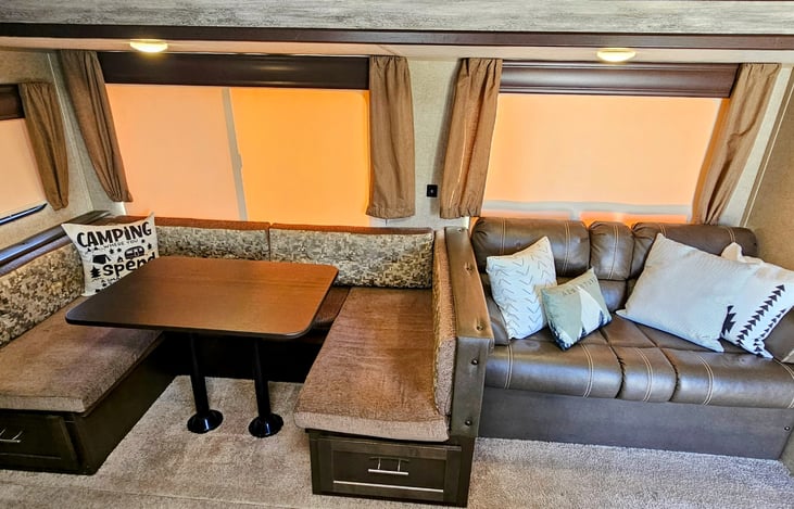 U shaped dining booth can be converted to additional sleeping area.  Sofa can also be folded out for another sleeping area.