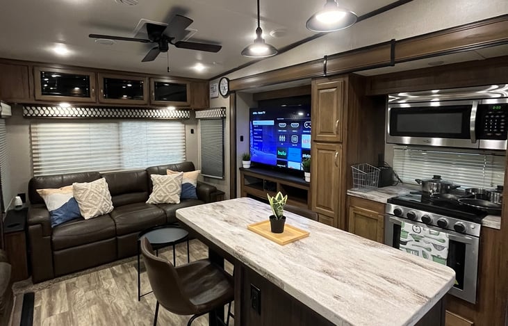 When you walk in (view of kitchen, island, living room)