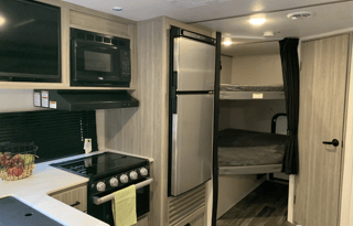 Sporty Little Giant Keystone RV Passport sleeps 7