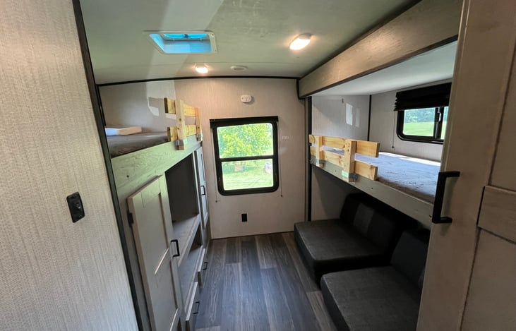 The bunk area 
2 bunks 
One entertainment area 
One couch / folds into bed