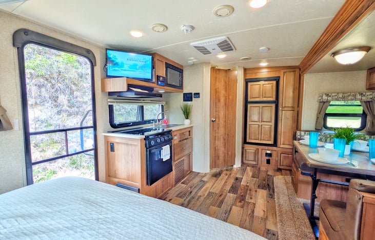 We love coming into the camper for a quick drop of the groceries and luggage-then out for the adventures!  But at the end of a long day - it's nice to lay in bed and watch a classic movie (provided).
