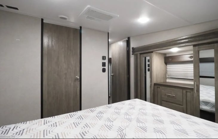 Master bedroom. View of bathroom door and hall door (open).