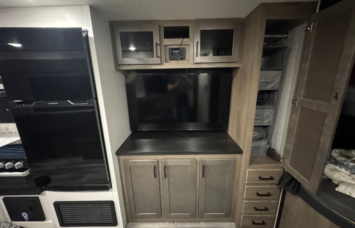 Main area and Fire Smart TV - With HD antenna hookup to pull in lots of local channels. Can be tethered to a cell phone for streaming