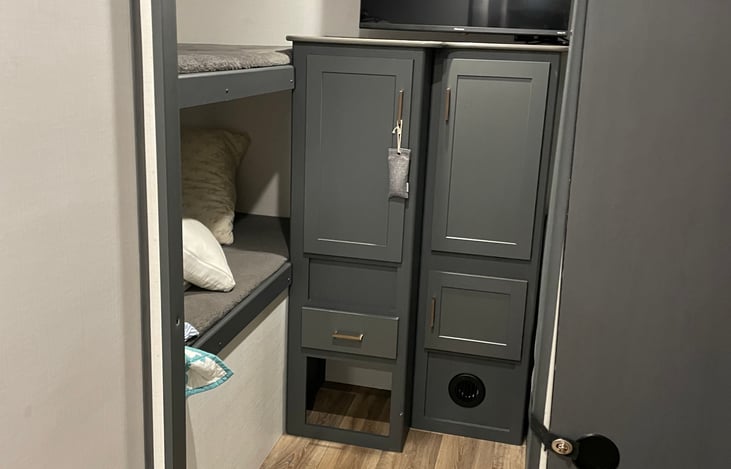 4 beds in the bunk house with two hanging closets and storage space.