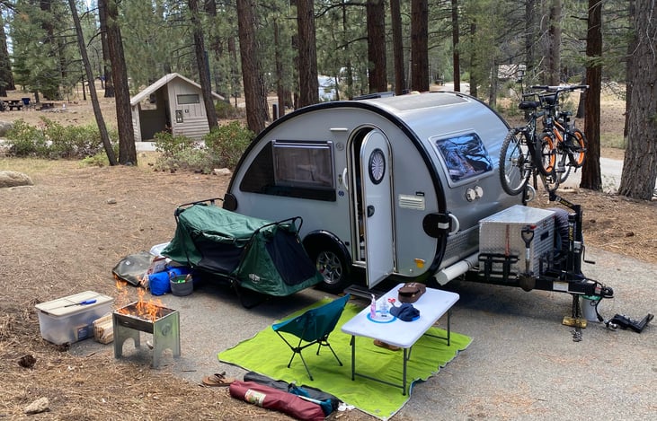 With optional bike carrier, single Camp-Cot, and large fire-pit grill.