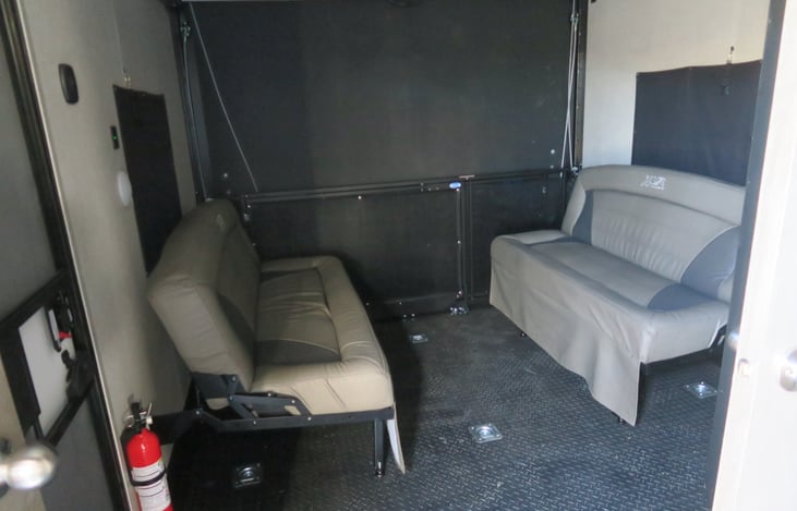 Garage with bunk bed on top. 2 sofas
