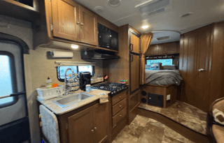 Adventure-Ready Coachmen 220QB w inflatable Kayaks
