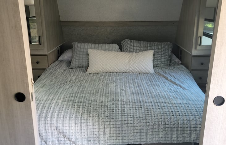 Master bedroom with storage under the bed. Phone charger station on his and her side!
