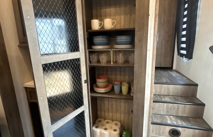 Storage with dishware and a starter supply of paper towels