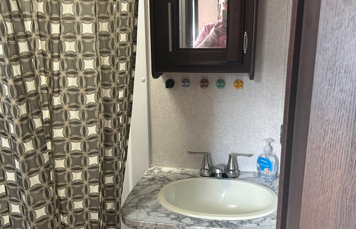bathroom with shower and sink