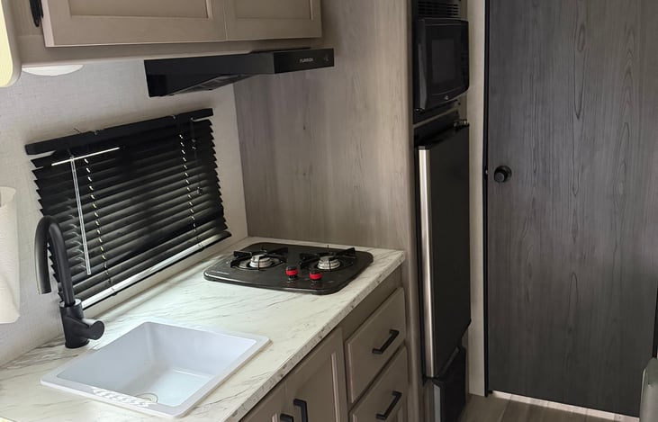 Sink, stove, microwave and refrigerator