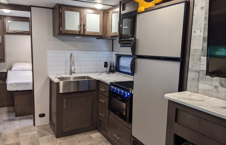 View of kitchen area, you can also see the private bedroom