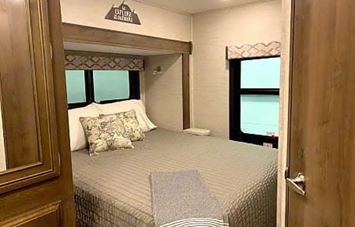 VERY comfortable walk around queen size bed. Reading lights, extra storage space.