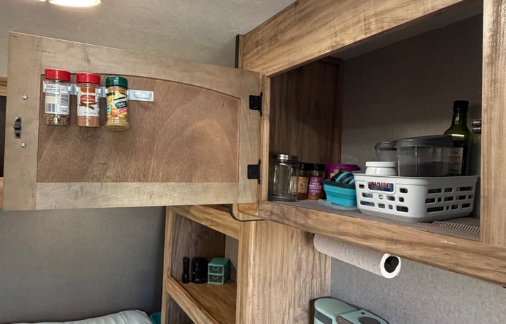 Kitchen includes basic essentials like plates, utensils, spices, salt and pepper for convenient meal prep during your stay.