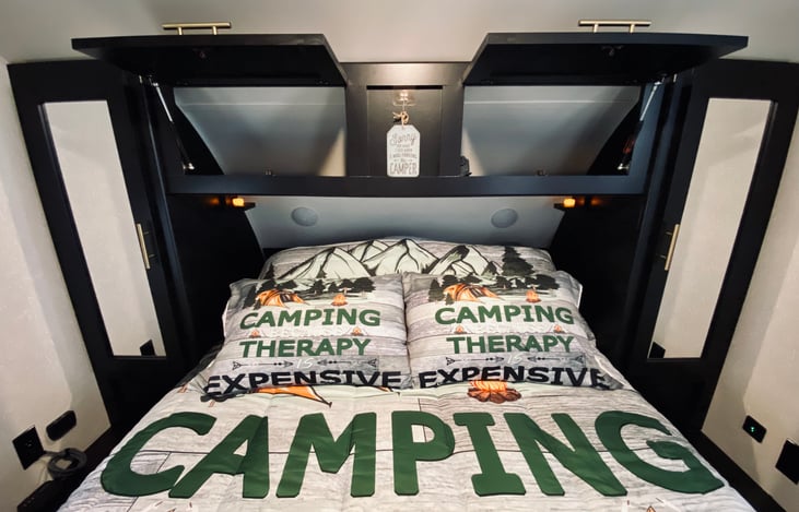 Overhead compartment for storage. Newly fitted with hydraulic hinges for easy access.