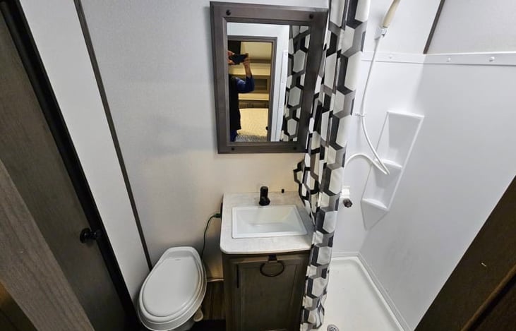 Bathroom. Nice Tall Shower with a bowed-out curtain rail. Plenty of space to wash up in