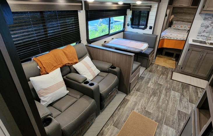 Main Living area dinette is right next to the seating area and provides a great view of the tv as well as the great outdoors.