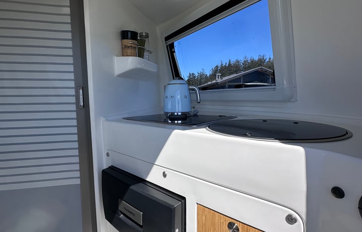 Smeg kettle to make your coffee that plugs into an outlet. You can use the outlet if you’re using the solar and/or if you are plugged into electricity at a RV campground.
