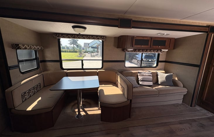 Spacious dining table for 7 and comfy loveseat. Both convert into beds!!