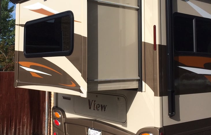 Rear slide increases rear sleeping room to accommodate queen size be.