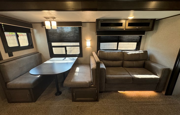 Dinette and sofa convert to beds.