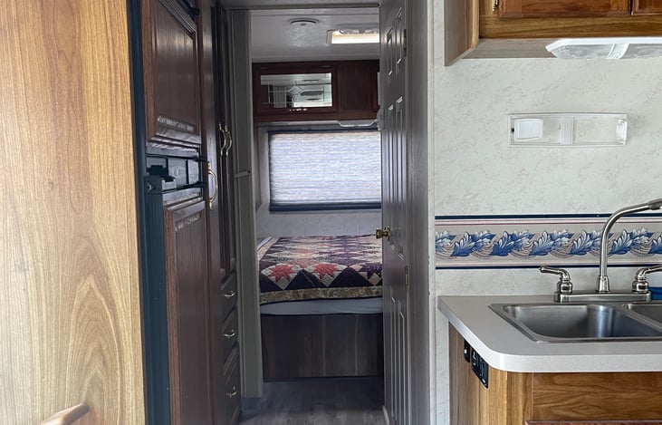 King bed in back with privacy “screen”