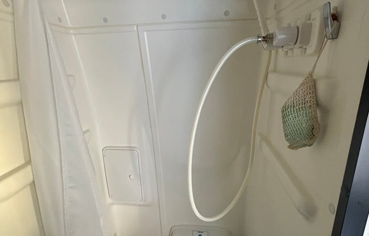 Combo shower/toilet (outside shower too)