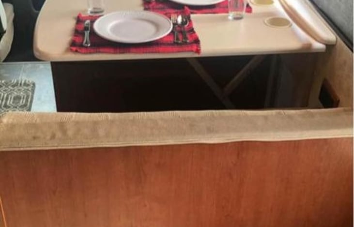 Dining table that doubles as a small bed.