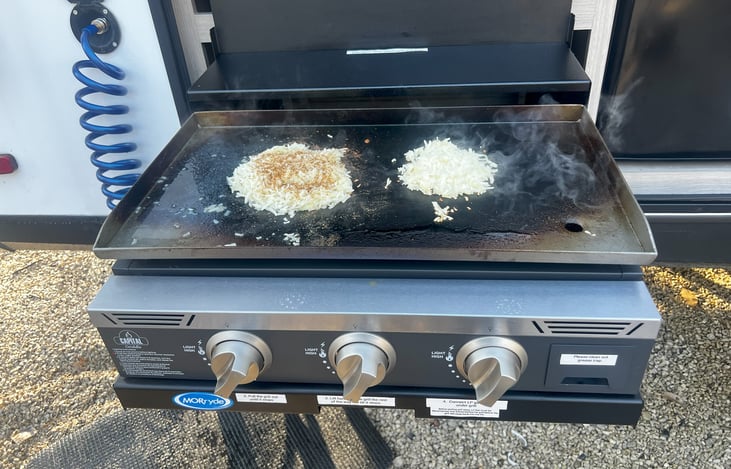 Breakfast on the grill.  Quick connect water sprayer, plugs in on both side of camper.