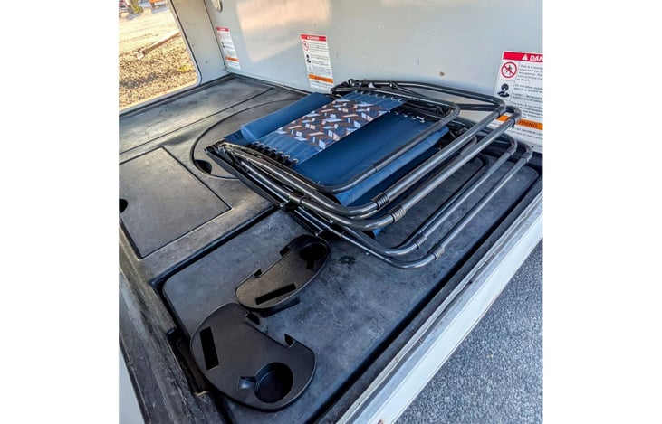 Back storage 
Folding table underneath the chairs