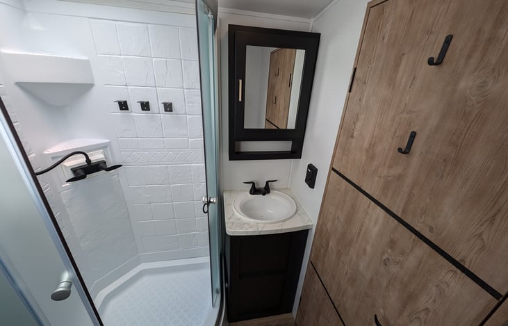 Very spacious bathroom with storage.