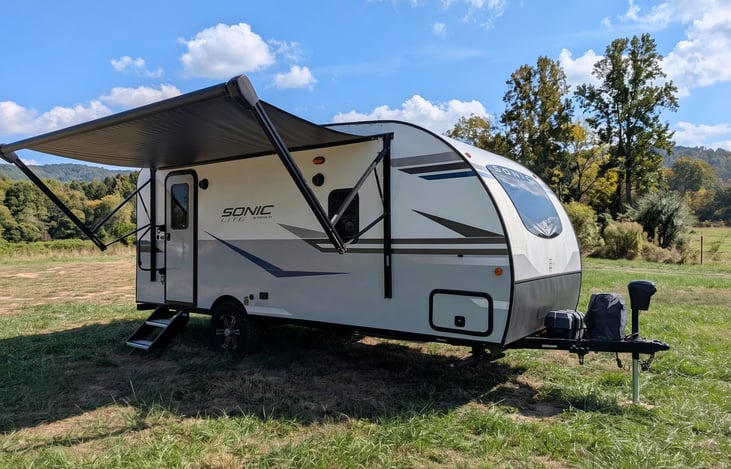 Easy-tow 2022 Venture Sonic Lite (3,600 lbs)! Features off-grid solar, all-terrain tires, slide-out, spacious rear kitchen, queen bed & power awning. Perfect couple's getaway for any adventure!