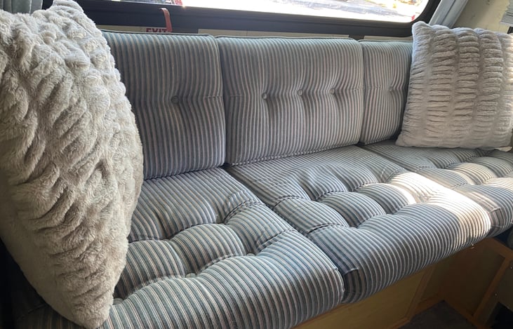 The rear couch folds out to fit two people. All of Winne's interior is original and in wonderful shape. It's very clean too.