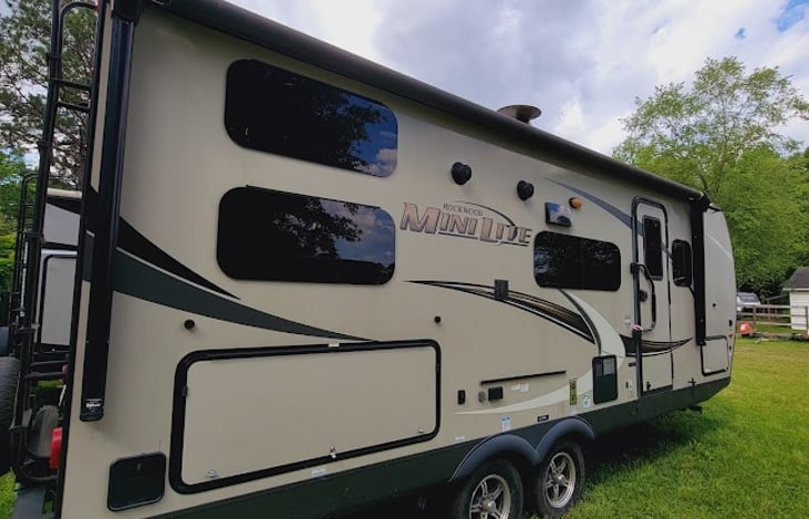 Rear camp side with closed outdoor kitchen.
