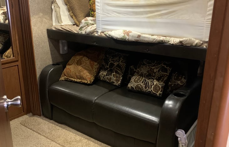 Bunkhouse couch folds out into a sleeper.