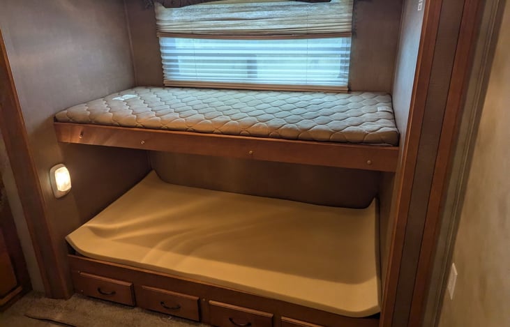 Bunk beds on each side of the bunk house with slide outs for lots of storage.