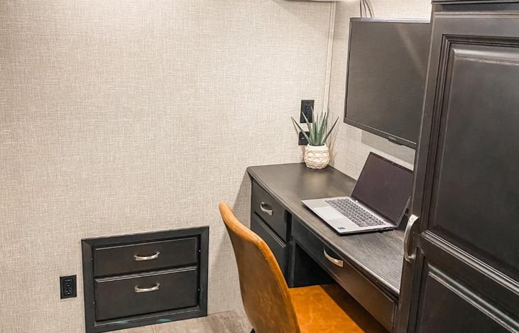 Second bedroom that has a bunk bed, sofa that pulls out to a full size bed and office space.