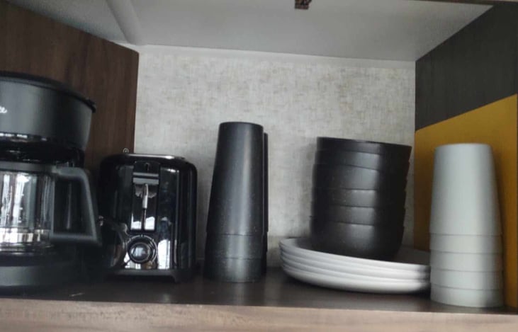 5 cup coffee maker, toaster and a dish service for 6 people.