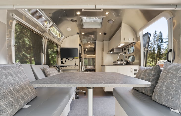 Spacious lounge area.  The dinette folds down for sleeping or watching TV and movies, or just reading book!