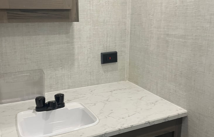 Bathroom sink and mirror roomie countertop