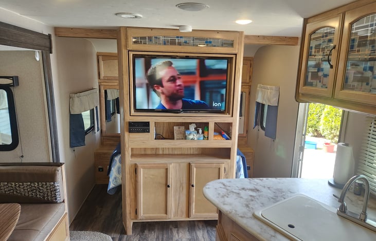 Large smart tv that spins from living area to private bedroom