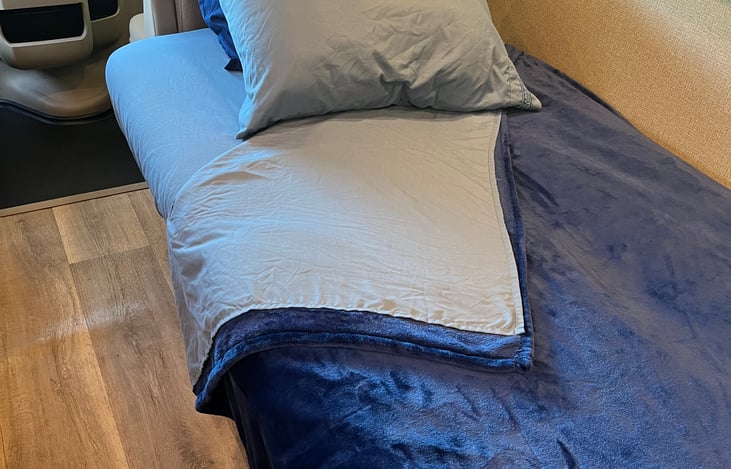 Sofa bed with included bedding. Sleeps one